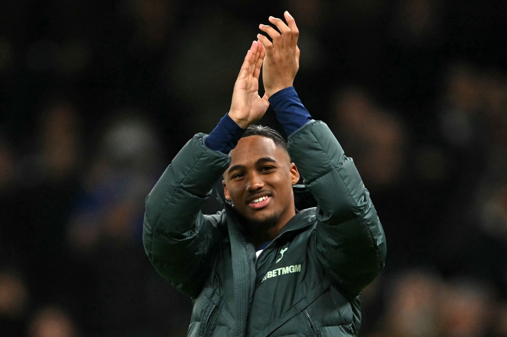 Tottenham Hotspur's French midfielder Wilson Odobert applauds the fans after the match. — AFP pic