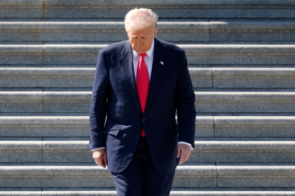 President Donald Trump departs the US Capitol following a Friends of Ireland luncheon with Irish Taoiseach Miche on Tuesday. — AFP pic