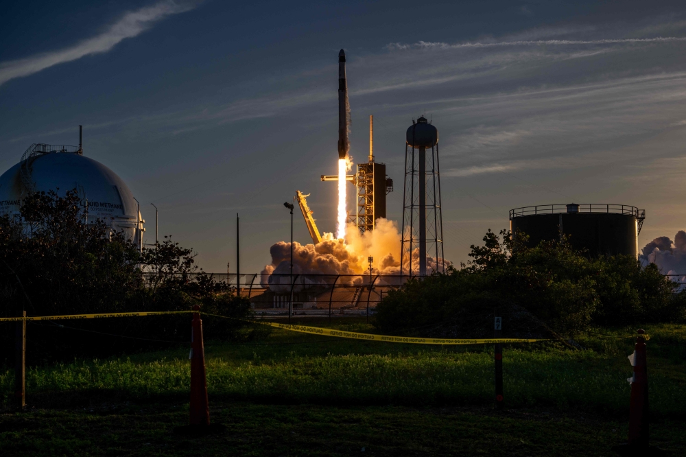 The SpaceX Falcon 9 rocket and Dragon spacecraft launches from the Launch Complex 39A at NASA's Kennedy Space Center on March 14, 2025 in Cape Canaveral, Florida. — AFP pic
