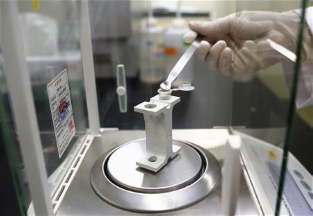 An examiner demonstrates the process of analysing a genetically-modified wheat sample, during a photo call at the Ministry of Food and Drug Safety in Seoul in this file photo taken on May 31, 2013. — Reuters pic