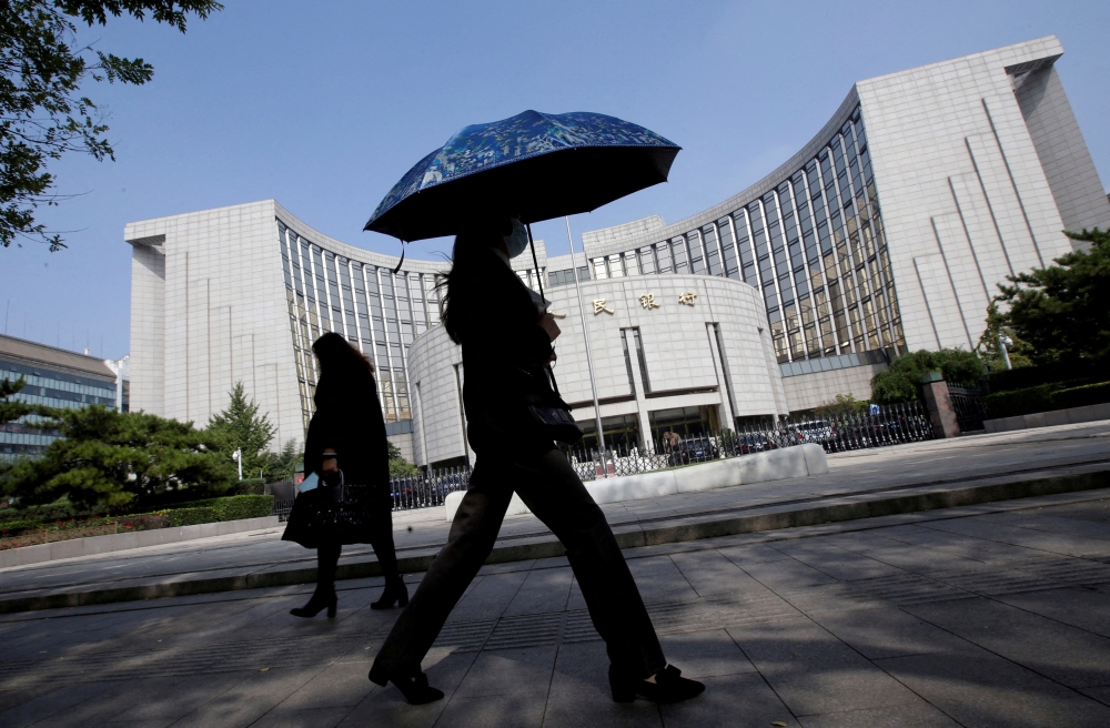 Days before the article in the official Shanghai Securities News, the central bank pledged to adjust monetary policy at the appropriate time to support an economy facing escalating trade tensions with the US. — Reuters pic
