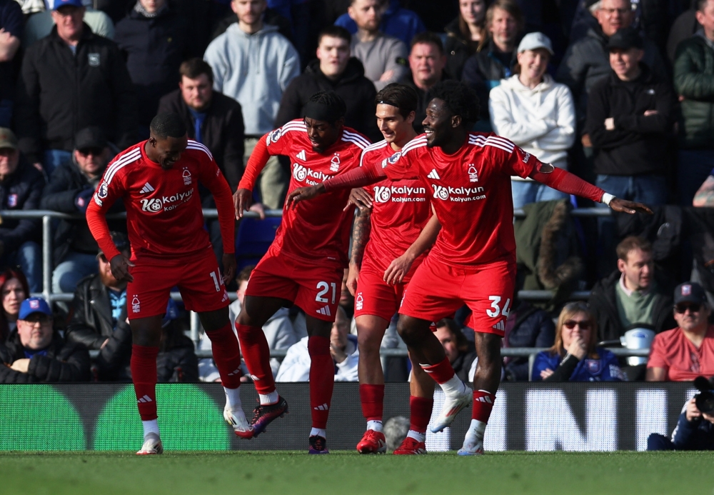 Nottingham Forest's Anthony Elanga celebrates scoring their second goal with Callum Hudson-Odoi, Ola Aina and Nicolas Dominguez. — Reuters pic