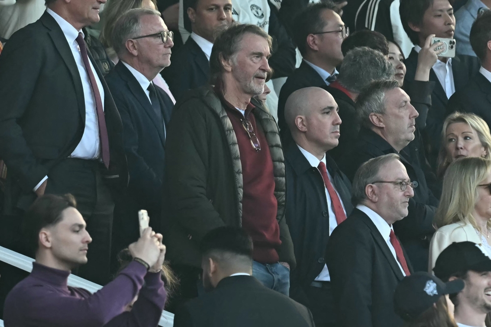 Manchester United's co-owner Jim Ratcliffe (centre) takes his seat for the English Premier League football match between Manchester United and Arsenal at Old Trafford in Manchester, north west England, on March 9, 2025. — AFP pic