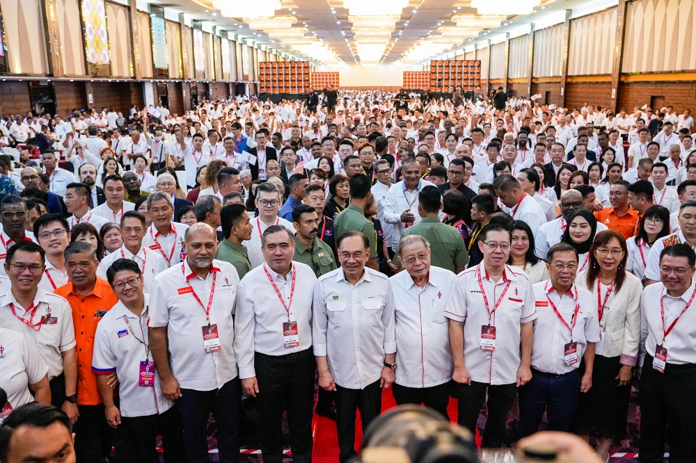 Prime Minister Datuk Seri Anwar Ibrahim, DAP secretary-general Anthony Loke and DAP leaders pose for a photo during the 18th DAP National Congress at Ideal Convention Centre (IDCC) in Shah Alam March 16, 2025. — Picture by Firdaus Latif