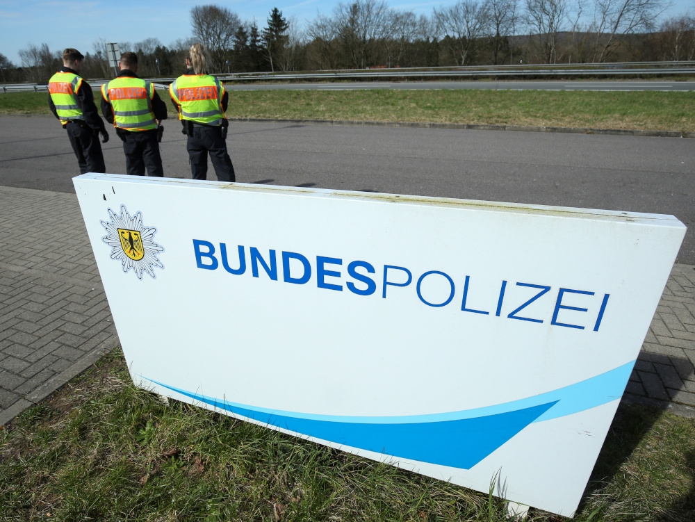 File picture of German police officers standing behind a sign that reads ‘Federal police’ in Saarbruecken March 16, 2020. A woman was doused in petrol and set alight by an unknown assailant on a tram in the eastern German city of Gera today, police said. — Reuters pic