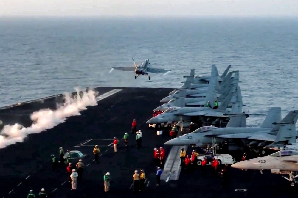 This screengrab from footage shared by the US Central Command (CENTCOM) on March 15, 2025 shows a US Air Force F/A-18 fighter aircraft taking off from an aircraft carrier at sea reportedly amidst operations launched against Houthis in Yemen. — AFP pic