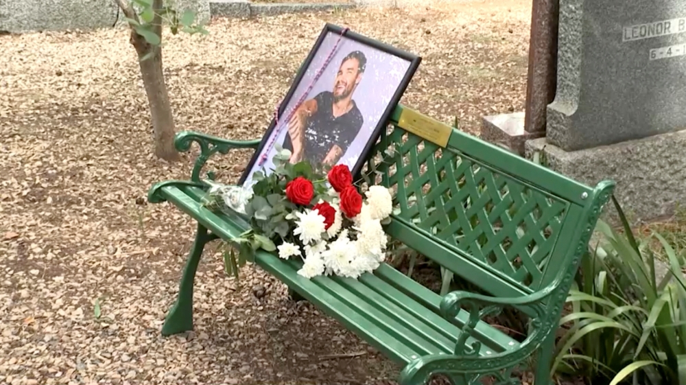 A portrait of late British singer Liam Payne and flowers sit on a bench unveiled by ‘One Direction’ fans at the British Cemetery in Buenos Aires, Argentina March 16, 2025, in this screen grab from video. — Reuters pic