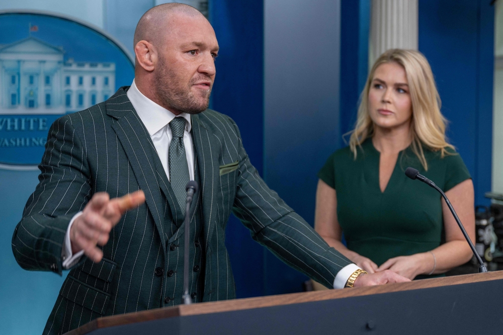 Irish professional mixed martial artist and businessman Conor McGregor speaks from the White House briefing room podium with White House Press Secretary Karoline Leavitt in Washington. — AFP pic