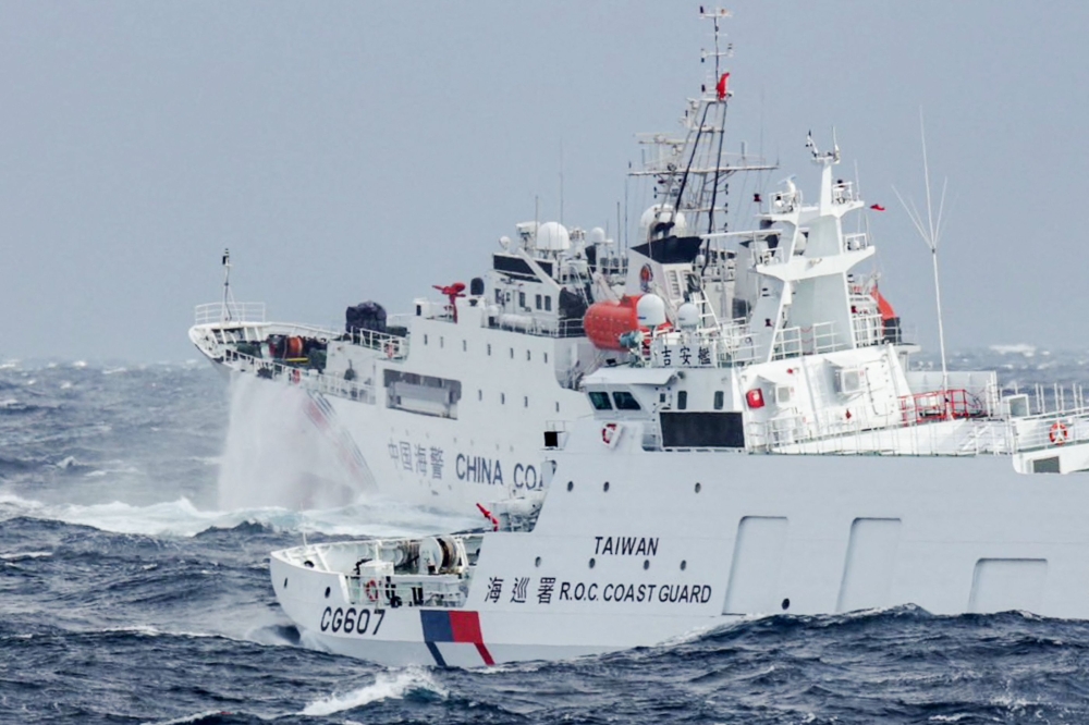 This handout photo taken and released by Taiwan's Coast Guard on December 12, 2024 shows a Taiwanese coast guard ship monitoring a Chinese coast guard ship, a few nautical miles from Taiwan's northeastern coast. — AFP pic