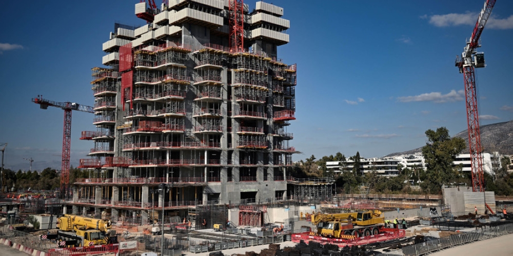 Cranes at the construction site of a 50-floor luxury tower, south of Athens, Greece. — AFP pic