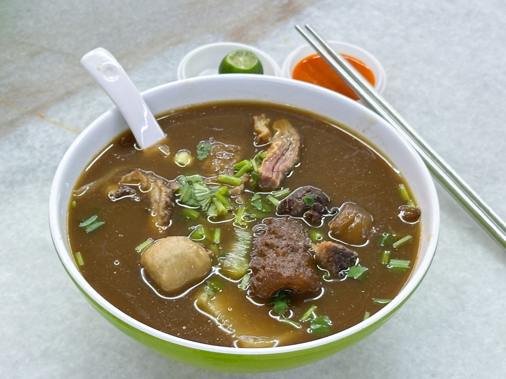 Shan Shan Beef Noodle offers a thicker, beefy broth to slurp down with their wider, flat rice noodles. — Picture by Lee Khang Yi