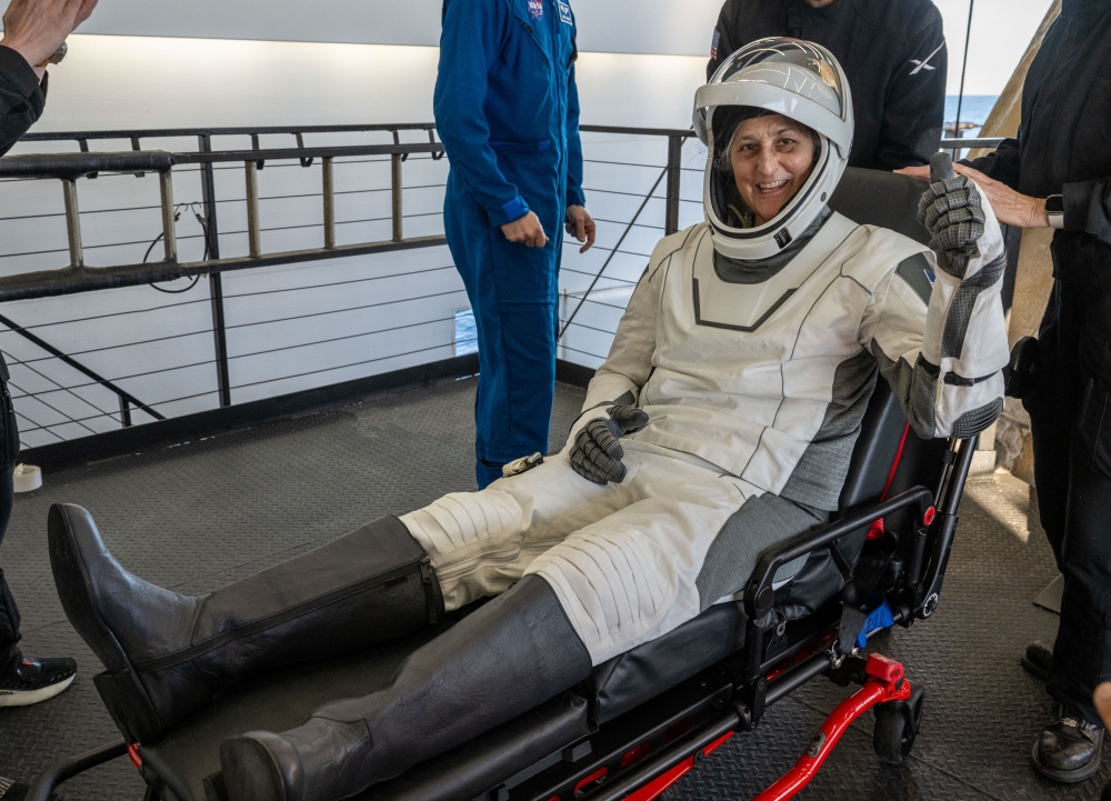 This photo provided by Nasa shows astronaut Suni Williams being helped out of a SpaceX Dragon spacecraft. — AFP