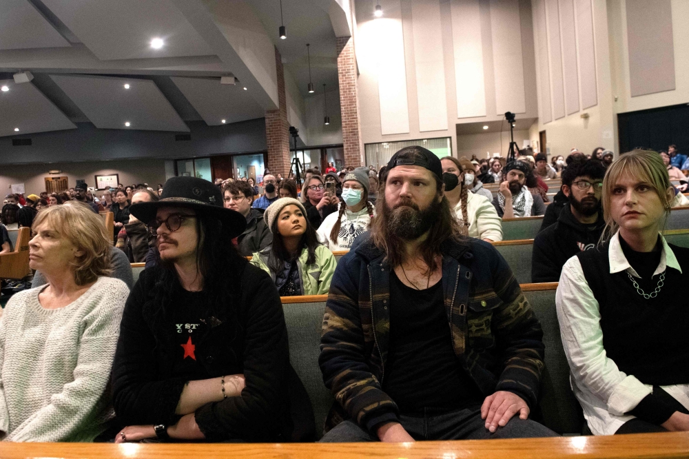 Participants listen to a speaker during an immigrants' rights gathering at the Shorter Community AME Church in Denver, Colorado February 17, 2025. Denver and the neighbouring city of Aurora, both homes to large immigrant populations, were both placed into the political spotlight during the past US presidential election when Republican presidential nominee and current US President Donald Trump declared Aurora was crime-ridden and overrun by undocumented migrant gang members of the Venezuelan gang Tren de Aragua. — AFP pic