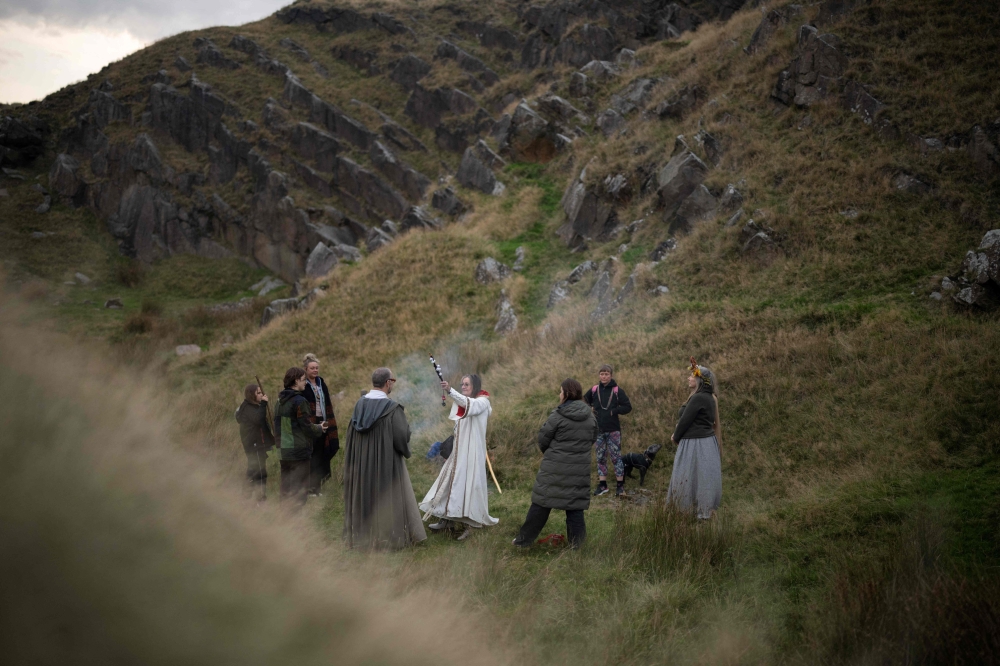 Members of Pendle Grove, part of the Order of Bards, Ovates & Druids, on Pendle Hill, meet near Clitheroe, north west England on September 21, 2024. — AFP pic