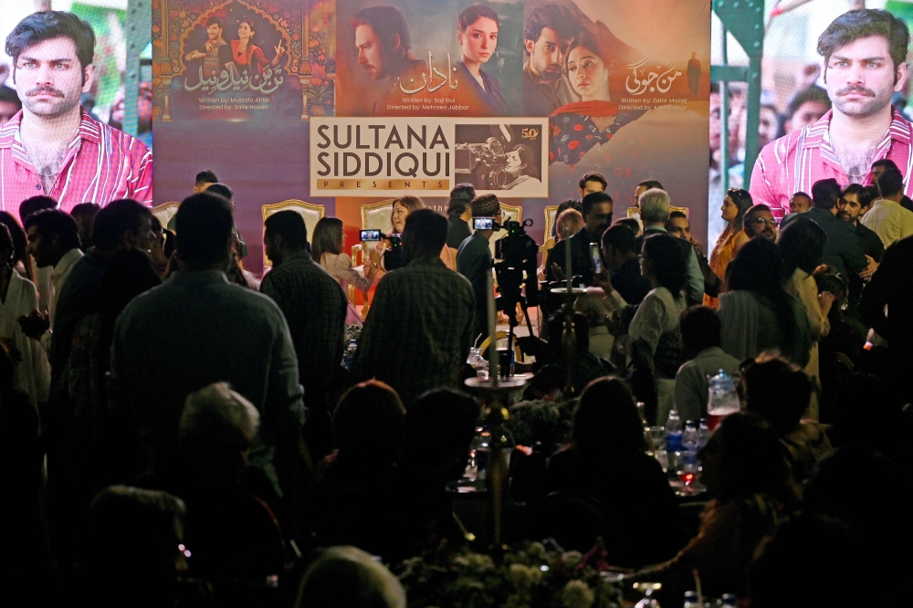 In this photograph taken on March 12, 2025, celebrities gather at the residence of Sultana Siddiqui, director, producer and founder of the Hum Network media company, during an event held to celebrate the success of her television drama 'Tan Man Neelo Neel'. — AFP pic