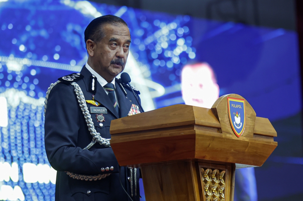 Inspector-General of Police Tan Sri Razarudin Husain delivers a speech at the Police Training Centre in Kuala Lumpur on March 20, 2025. — Bernama pic
