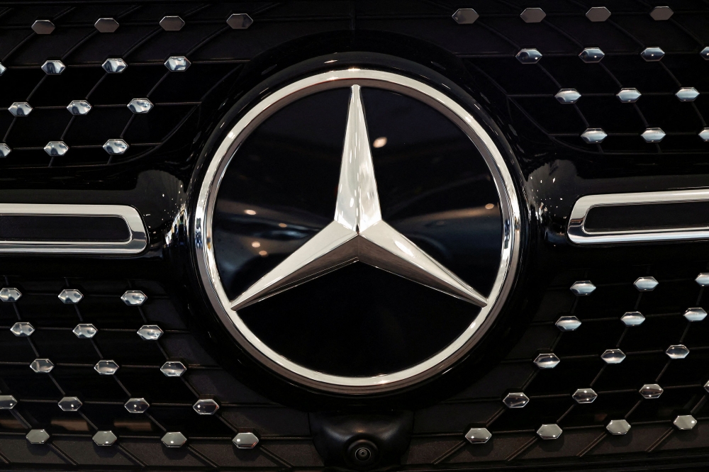 A logo of Mercedes-Benz is seen inside a Mercedes-Benz car dealer in Arnhem, Netherlands February 18, 2025. — Reuters pic