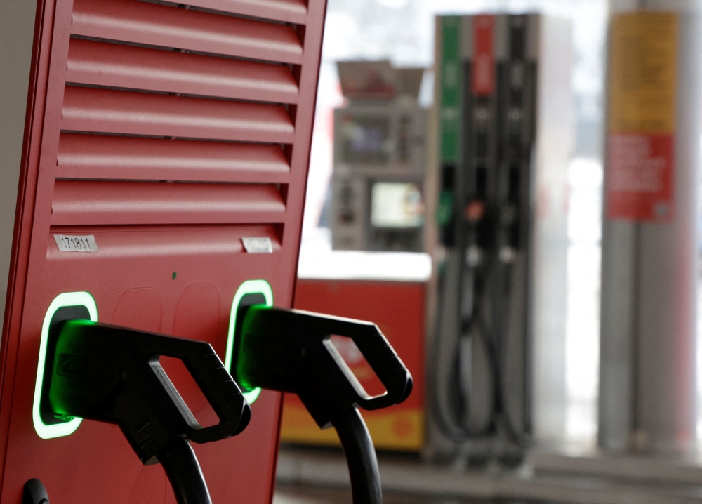 A view of charging points at a station that offers car charging points and fuel. — Reuters pic