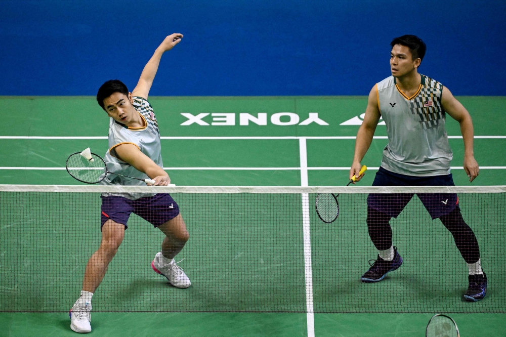 Malaysia's Goh Sze Fei (L) and Nur Izzuddin crashed our from the Swiss Open yesterday. — AFP pic