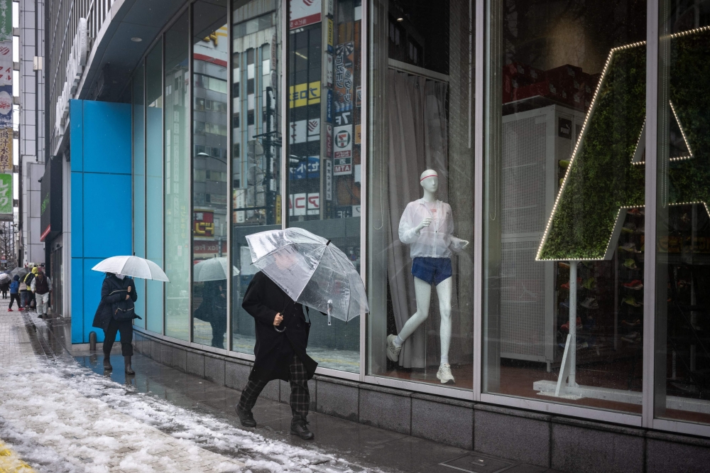 Rising prices for petrol, food and accommodation among other necessities have been squeezing Japanese households. — AFP pic