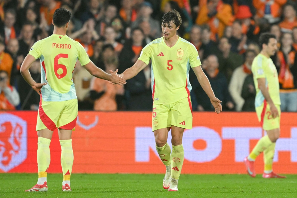 Spain's midfielder Mikel Merino (L) and Spain's defender Robin Le Normand react after the UEFA Nations League quarter-final first-leg match against Netherlands. — AFP pic