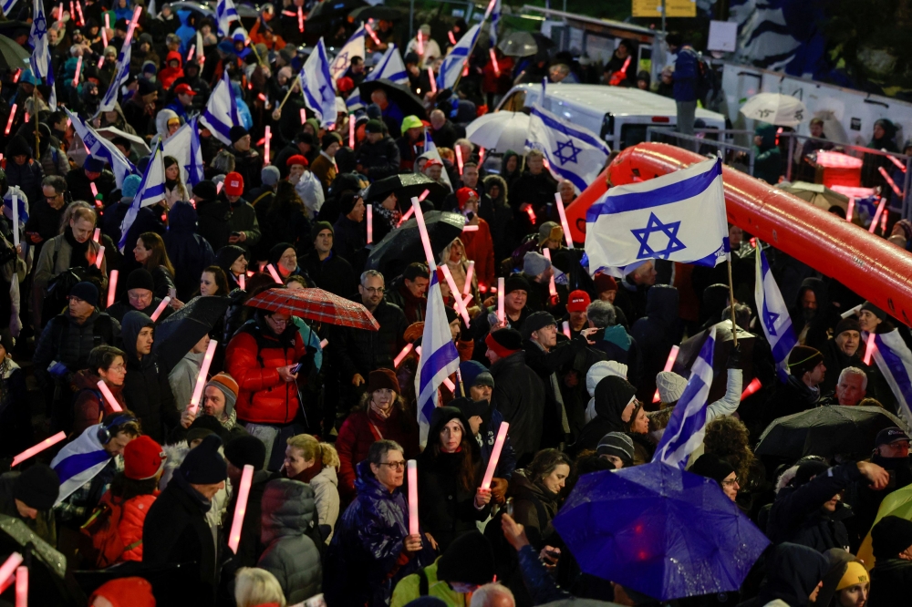 People take part in a rally against the Israeli government and Israeli Prime Minister Benjamin Netanyahu, and demanding the release of all hostages from Gaza, outside the Knesset, the Israeli parliament, in Jerusalem, March 20, 2025. — Reuters pic