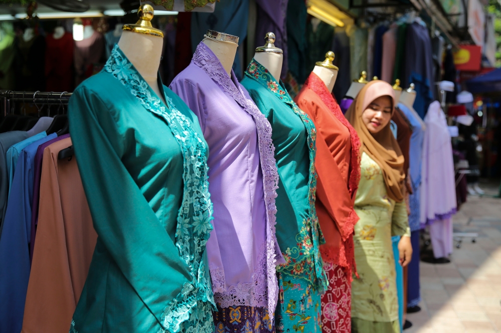 Traditional clothes are some of the things you can expect to find at Jalan TAR. — Picture by Yusof Mat Isa