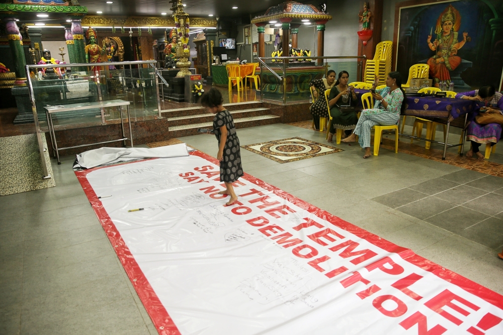 A banner protesting the demolition of the Dewi Sri Pathrakaliamman Temple is seen inside its premises on Jalan Munshi Abdullah in Kuala Lumpur on March 20, 2025. — Picture by Choo Choy May .