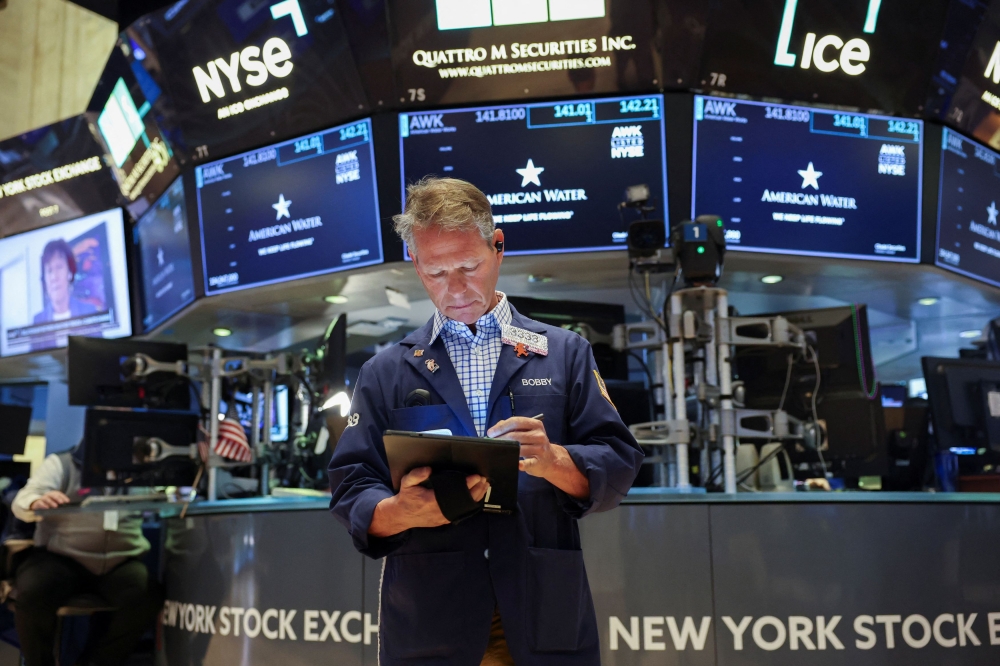 A trader works on the floor at the New York Stock Exchange (NYSE) in New York March 21, 2025. — Reuters pic