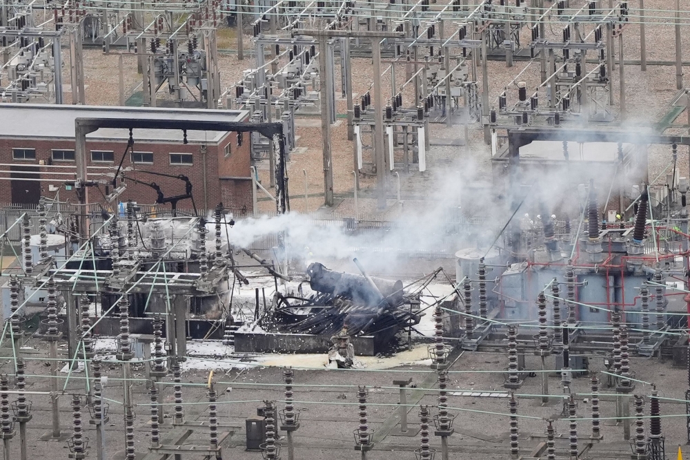 An aerial view shows smoke billowing from a substation supplying power to Heathrow Airport after a major fire at an electricity substation on March 21, 2025 cut power to the sprawling facility west of London and stopped flights from departing or landing for 24 hours. — AFPpic