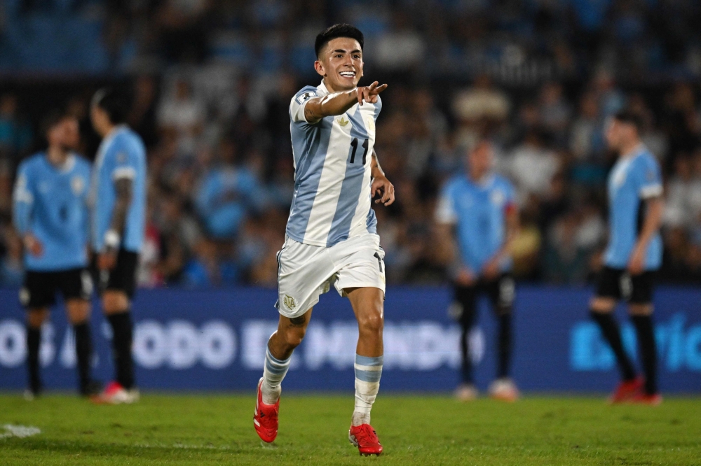 Argentina’s midfielder Thiago Almada jubilates after scoring during the 2026 FIFA World Cup South American qualifiers between Uruguay and Argentina at the Centenario stadium in Montevideo, on March 21, 2025. — AFP pic