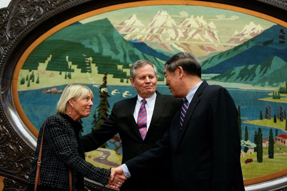 US Senator Steve Daines introduces his wife Cindy Daines to Chinese Vice Premier He Lifeng before a meeting held in the Xinjiang Room at the Great Hall of the People in Beijing, China, March 22, 2025. — Reuters pool pic