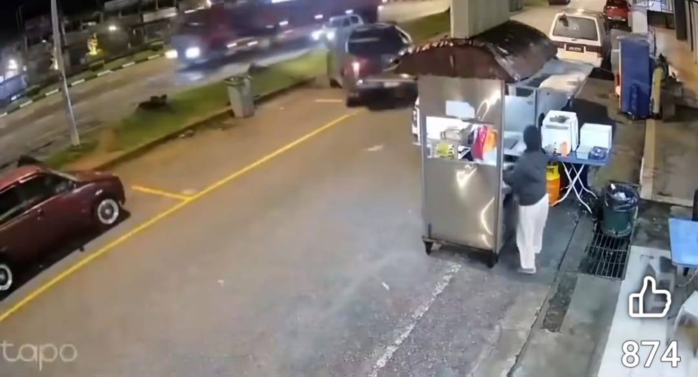 A screen capture shows the pickup truck about to mount the curb.