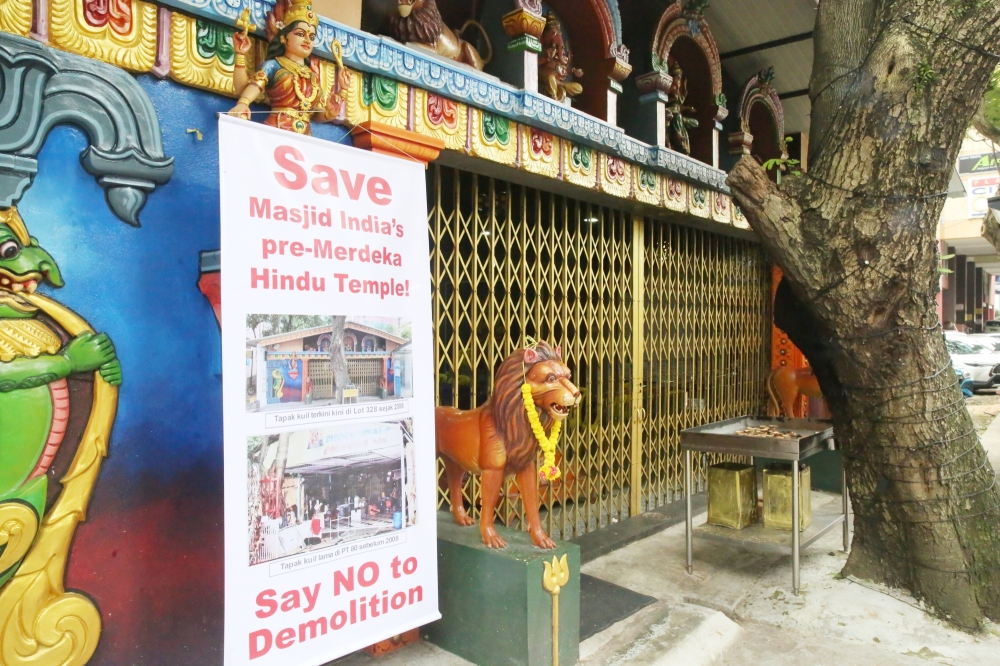 A banner protesting the planned demolition of the Dewi Sri Pathrakaliamman Temple is seen outside its premises on Jalan Munshi Abdullah in Kuala Lumpur on March 20, 2025. — Picture by Choo Choy May .