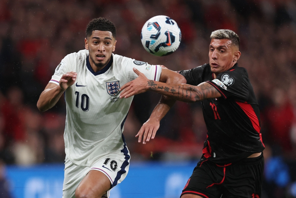 England's Jude Bellingham in action with Albania's Myrto Uzuni during the World Cup European Qualifiers for Group K at Wembley Stadium, London March 21, 2025. — Reuters pic 