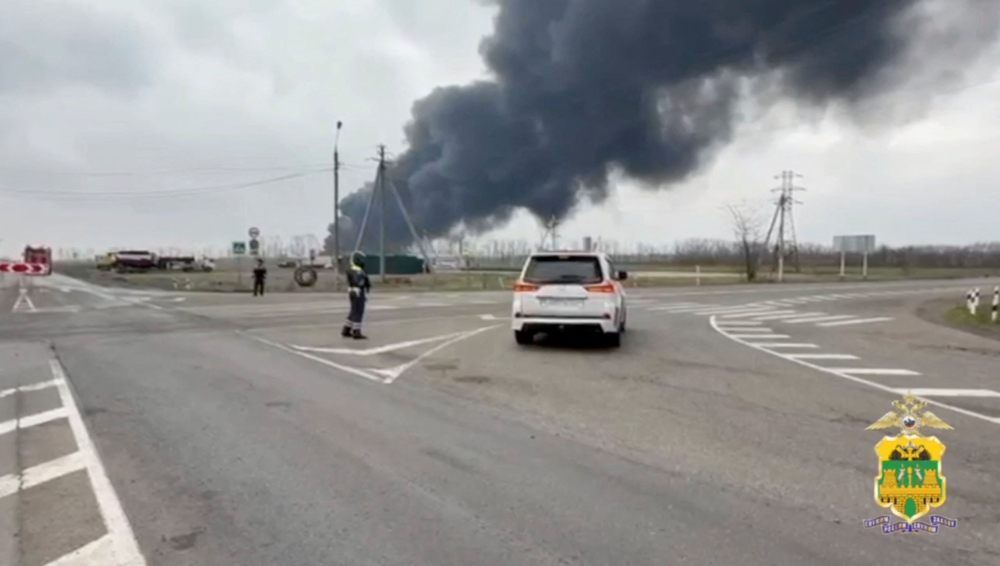 Black smoke rises from the site of fire following an explosion at an oil depot, which was recently hit by a drone what local authorities called a Ukrainian a military strike, in the settlement of Kavkazskaya in the Krasnodar region, Russia, in this still image from video released March 21, 2025. — Krasnodar Region's Ministry of Internal Affairs handout pic via Reuters
