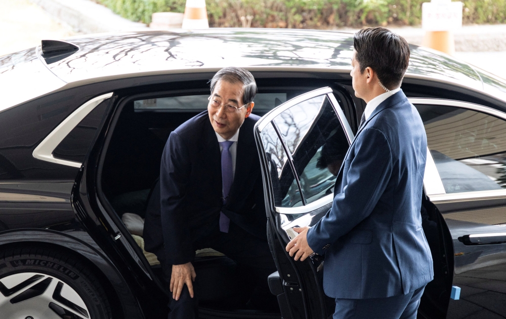 Prime Minister Han Duck-soo, was reinstated on Monday as South Korea’s acting president. — Reuters pic