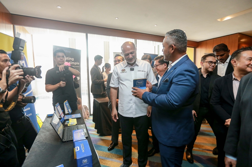 Minister of Digital Gobind Singh Deo meeting company representatives during the MoU Signing Ceremony of SMEs and MDEC in Business Digitalisation Initiative at Aloft Hotel. March 25, 2025. — Picture by Sayuti Zainudin