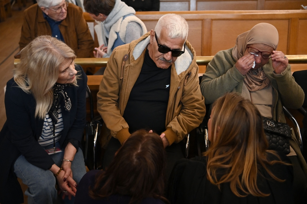 Kamel (centre) and Djohar Daoud (right), the parents of the victim Chahinez Daoud, seat before the trial of Mounir Boutaa who appears for murder at the Gironde Assizes Court in Bordeaux on March 24, 2025. — AFP pic 