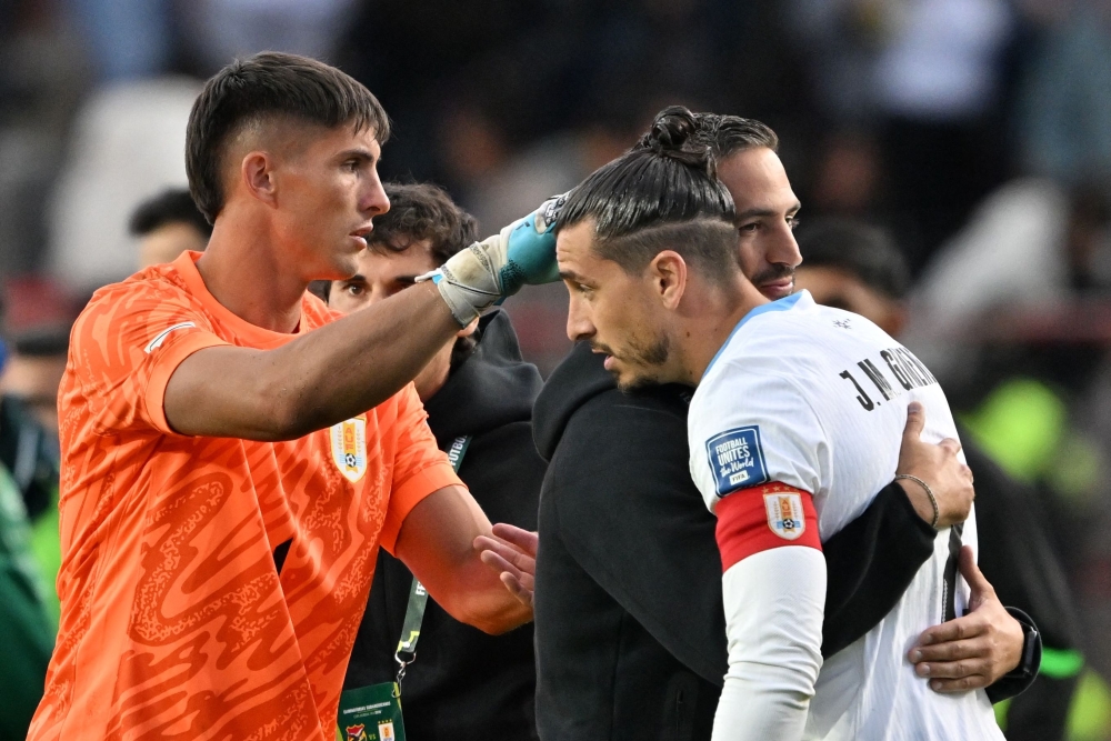 Uruguay’s goalkeeper Sergio Rochet and defender Jose Maria Gimenez react at the end of the 2026 Fifa World Cup South American qualifiers match with Bolivia in El Alto, Bolivia, March 25, 2025. — AFP pic