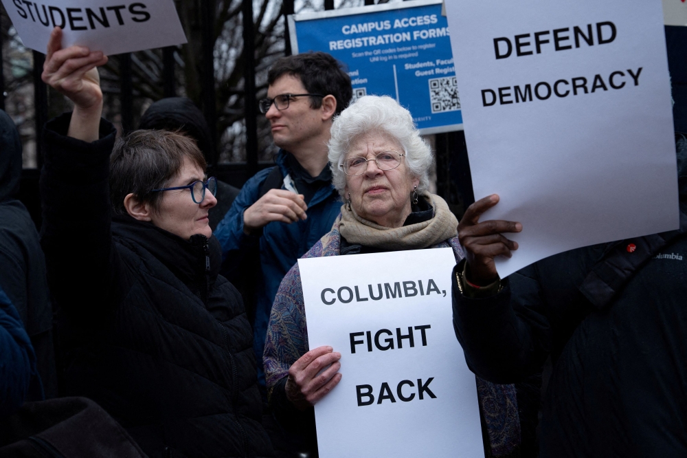 Columbia and Barnard faculty stage a protest and press conference to condemn the university’s concessions to the federal government and call for a defence of academic freedom and democracy at Columbia University in New York March 24, 2025. — Reuters pic