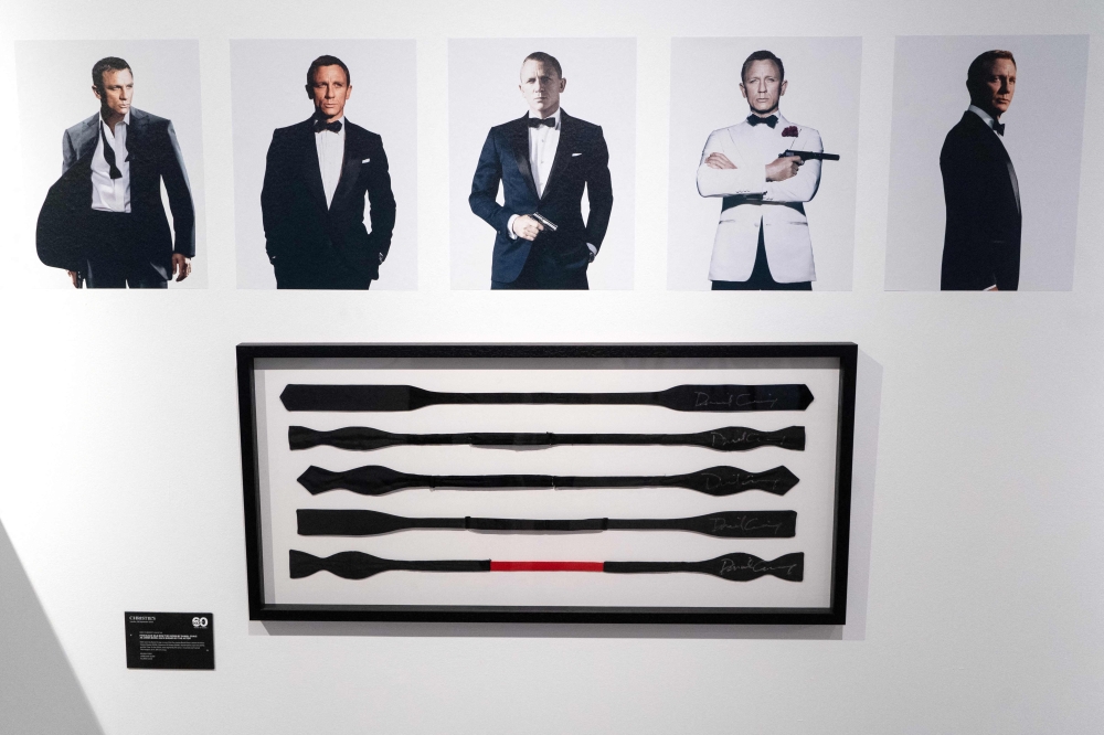 Black bow ties, signed and worn by British actor Daniel Craig in the five James Bond films he starred in, are displayed during a photocall ahead of the 'Sixty Years of James Bond' auction at Christie's auction house in London September 26, 2022. — File pic via AFP 