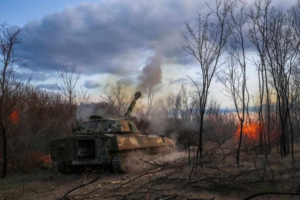 Servicemen of 39th Separate Coastal Defence Brigade of the Ukrainian Armed Forces fires a 2S1 Gvozdika self-propelled howitzer towards Russian troops in a front line, amid Russia’s attack on Ukraine, in Kherson region, Ukraine March 23, 2025. — Reuters pic