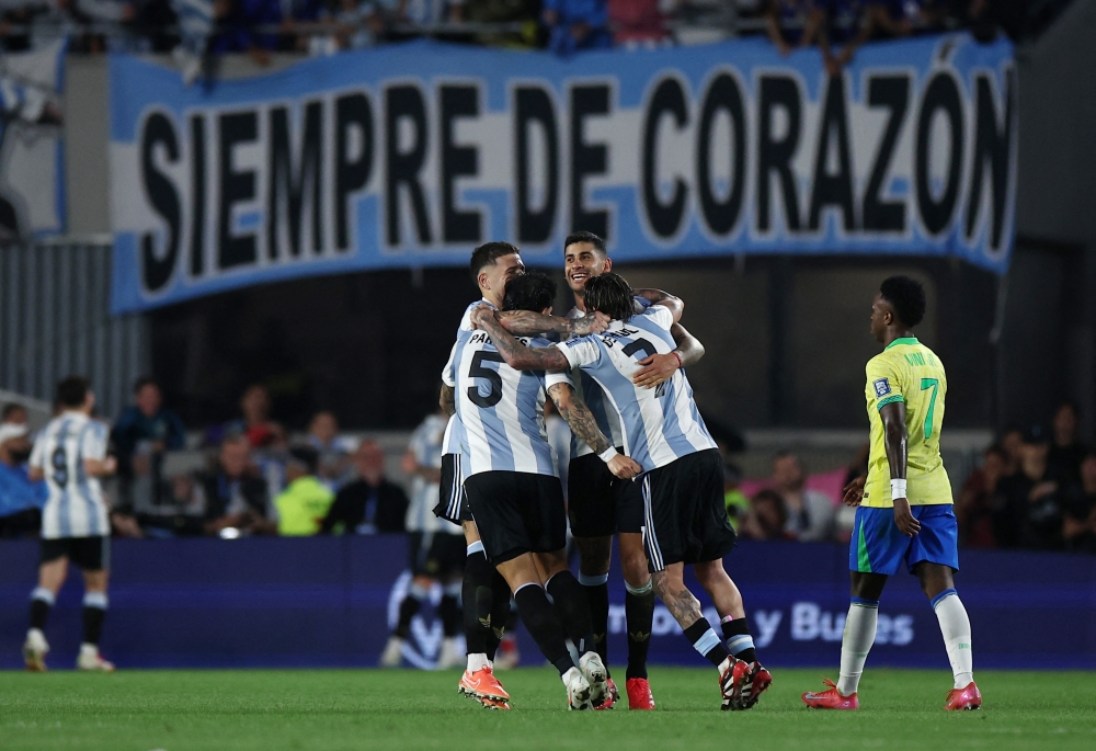 Argentina’s Giuliano Simeone celebrates scoring their fourth goal with teammates during their World Cup – South American qualifying match against Brazil in Buenos Aires March 25, 2025. — Reuters pic