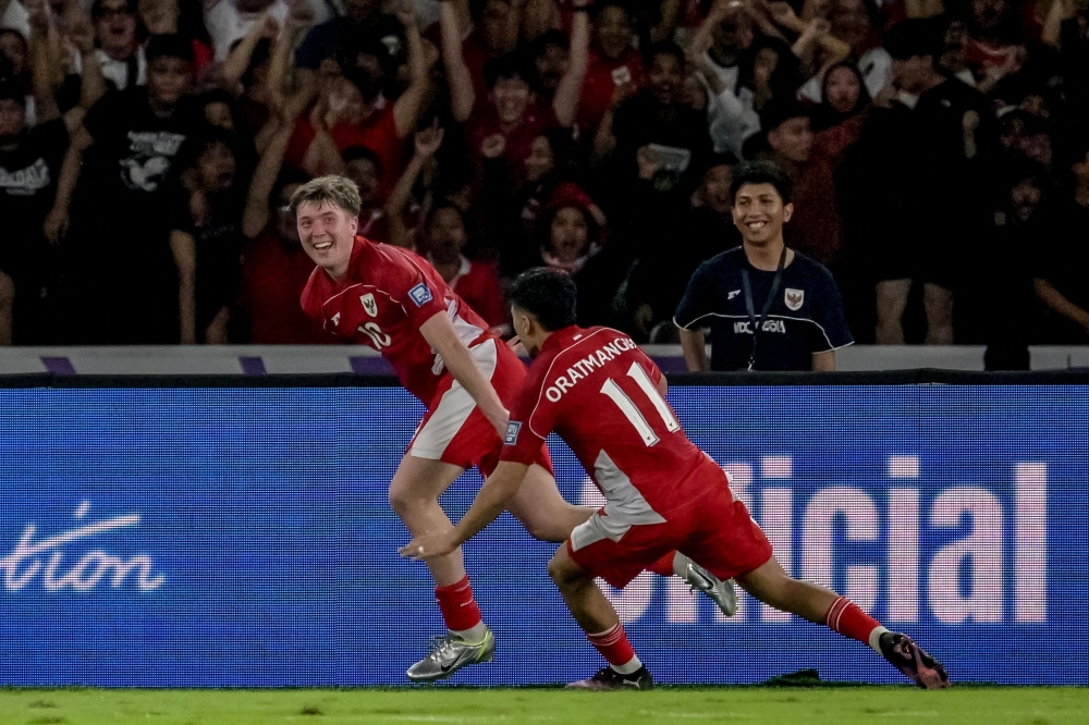 Indonesia’s Ole Lennard Romenij and his teammate celebrate the goal during the World Cup 2026 Asian qualifier match with Bahrain at Bung Karno Stadium in Jakarta March 25, 2025. — Reuters pic