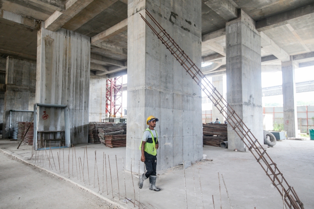 A taskforce identified and monitored 230 delayed private housing projects, 347 sick projects and 116 abandoned projects last month. — Picture by Hari Anggara.