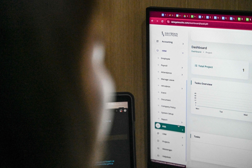 This photo taken on September 26, 2024, shows Philippine’s ‘virtual assistant’ Lyann Lubrico working at her home in Quezon City, Metro Manila. — AFP pic