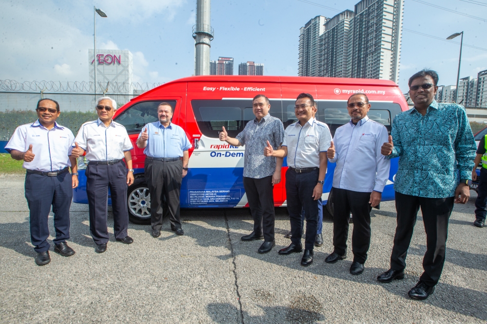 Transport Minister Anthony Loke poses with officials during the launch of the Rapid KL On-Demand open payment service at at Rapid Bus Maluri Depot, Jalan Cheras, Kuala Lumpur. March 27, 2025 — Picture by Raymond Manuel