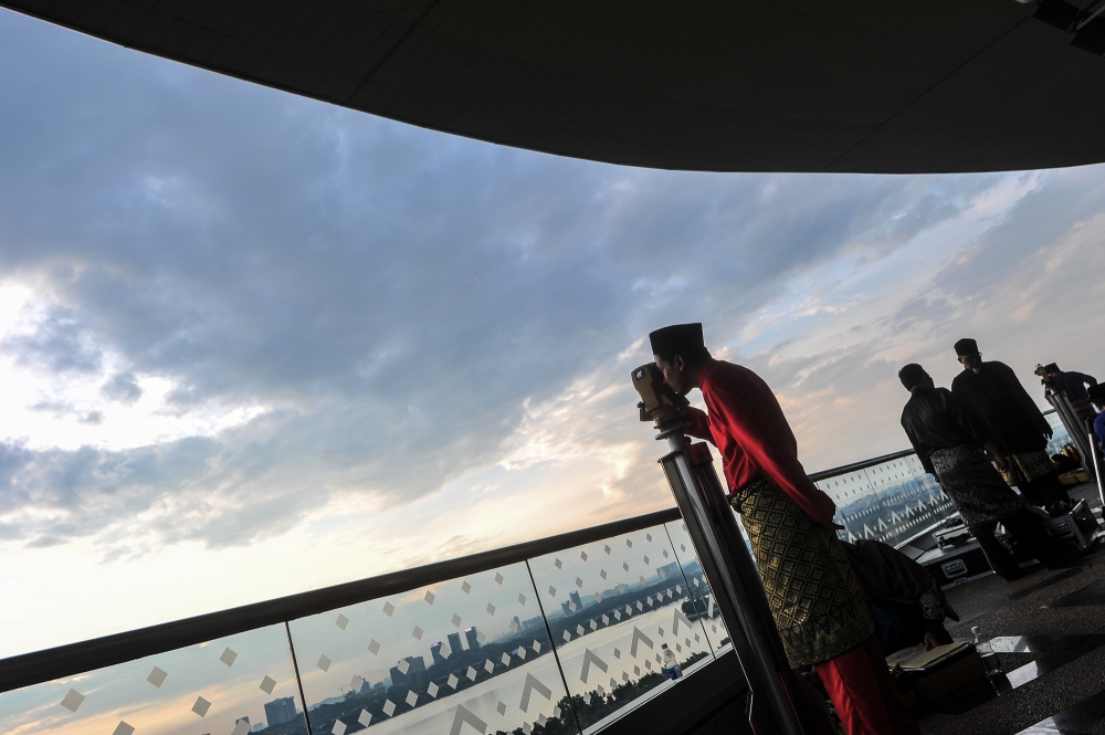 Malaysia uses a combination of hisab and rukyah. Calculations predict the moon’s position, but officials still conduct physical observations to confirm the sighting. — Picture by Shafwan Zaidon