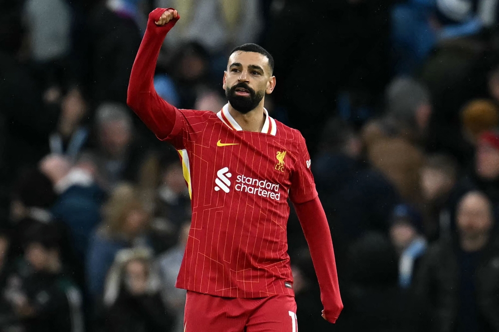 Liverpool's Egyptian striker #11 Mohamed Salah celebrates scoring the opening goal during the English Premier League football match between Manchester City and Liverpool at the Etihad Stadium in Manchester February 23, 2025. — AFP pic